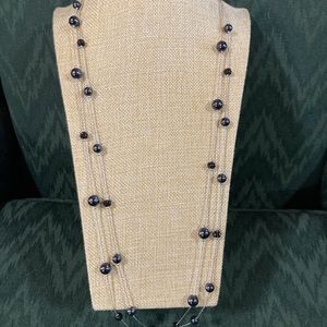Silver tone 2 strand chain with black bead & black crystal stations. Signed RMN